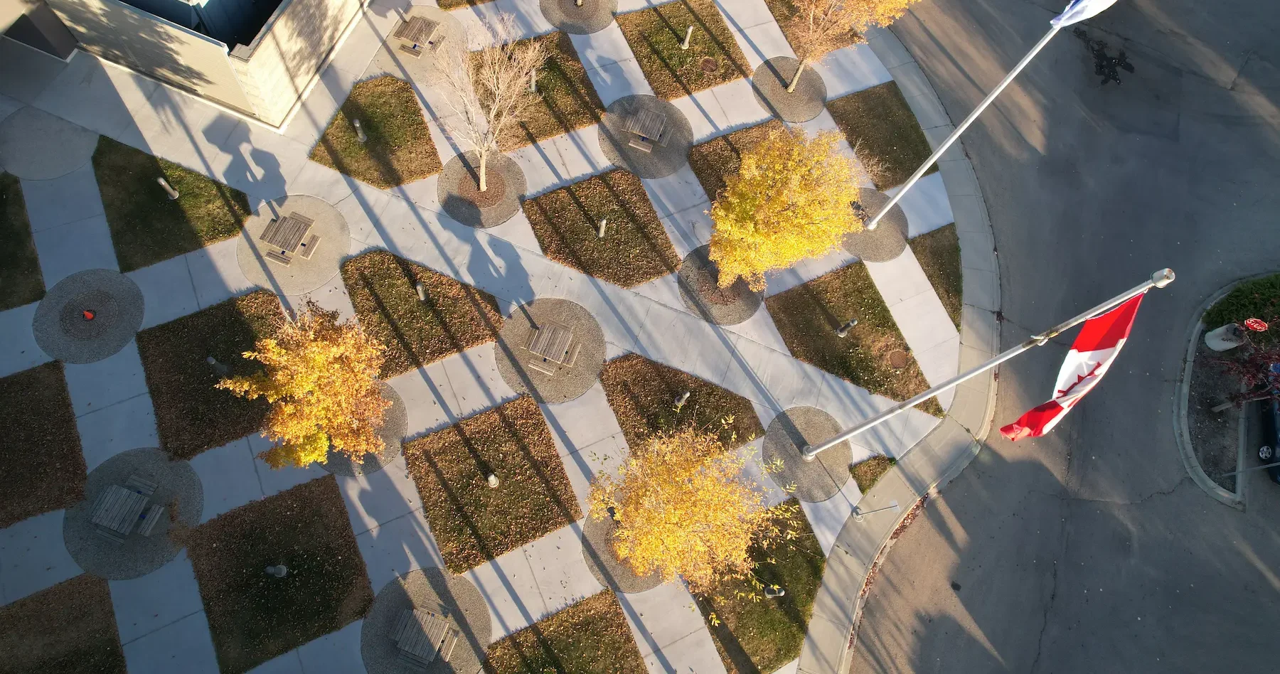 Aerial view of urban park with skatepark, playground, drainage and green spaces